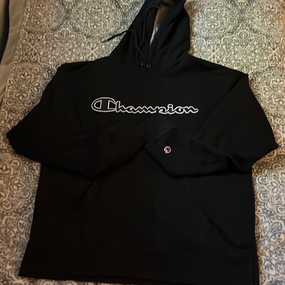 Black champion with black and white lettering, in a mens large!